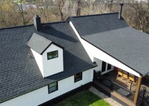 Aerial view of a newly replaced roof on a white house in North Huntingdon, PA.