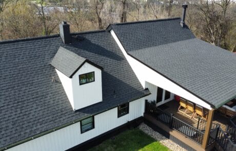 Aerial view of a newly replaced roof on a white house in North Huntingdon, PA.