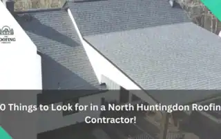 Aerial view of a residential roof with new gray shingles in North Huntingdon.