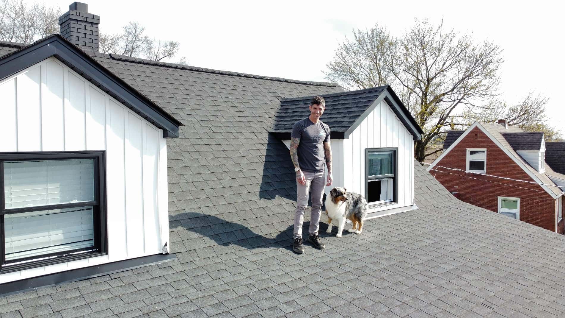 dji_fly_20250414_164136_549_1745076671002_photo_optimized Man and dog on a residential roof in Pittsburgh, PA.