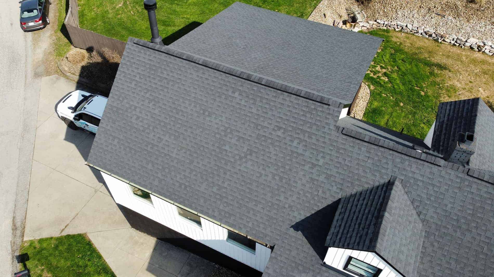 Aerial view of a residential roof with new asphalt shingles in Pittsburgh.
