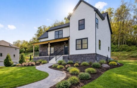 siding_1769533119483-DSNGXKv4 (1) Modern white house with black trim and a landscaped yard in Pittsburgh.