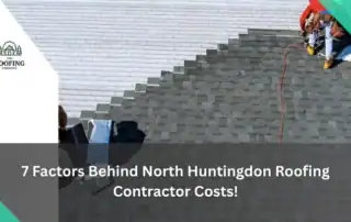 Roofing contractor inspecting a gray shingle roof in North Huntingdon.